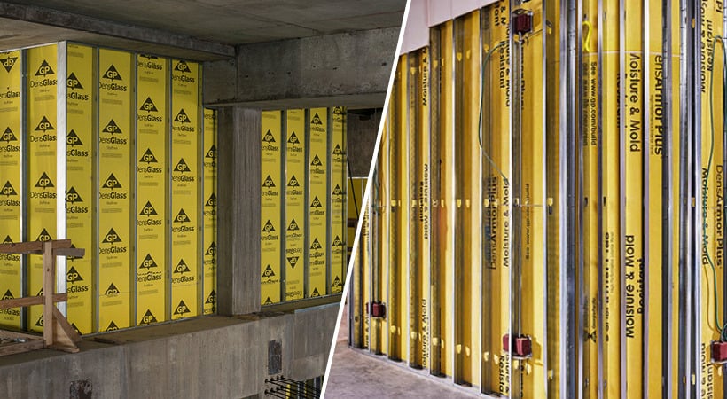 The aftermath of a flooded commercial building, gutted down to the concrete, load-bearing walls, with debris littering the floor.