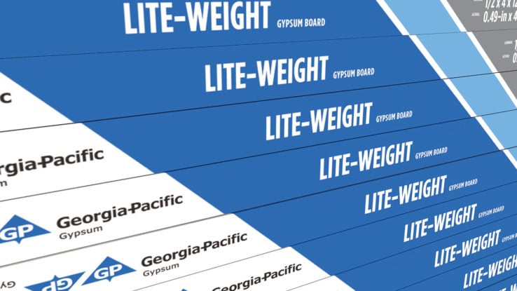 ToughRock® Lite-Weight Gypsum Board - close up of side tape which is vertical lines in the color light blue, blue, white and gray